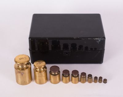 Cased Set of Brass Weights at Dolan's Art Auction House